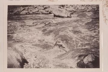 Ellsworth Kolb in Rapid 22. Copy of print in Lint album. Copyright mark indicates the photo is by Emery Kolb