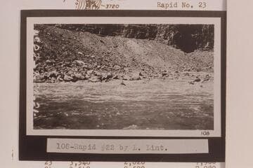 Rapid No. 22 in Cataract Canyon. Rapid No. 22 heads at Mile 202.45 and drops 8 ft. in .15 miles. There is disagreement of one day between LaRue's journal and the date on Lint's film