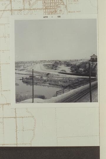 Looking south-southeast from bridge to Hill over tracks [on photo reverse:  From railroad overpass--note island with brush--see 1964 shots]