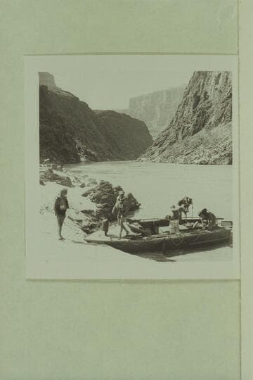 Preparing the camera boat for leaving Separation Canyon. Dock Marston on the beach; Roy Klinger steps ashore; Gordon Avil, Dick Kelly and Vee Bodrero in the boat