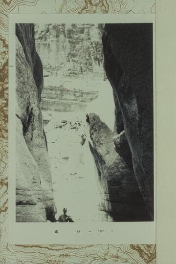 Out of narrow inlet from side canyon at left bank of main wash (right hand or easterly fork) of Separation Canyon