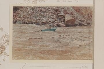 Harrris-Brennan boat at foot of Rapid 22, Cataract Canyon.  The Sliced Boulder is at right.  Compare its position with 64-4-1 CTCN 202-21