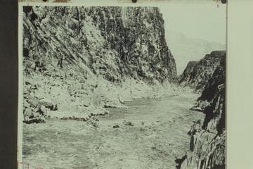 Elwyn Blake at the oars of the "Glen" in Separation Rapid. The big wave to the left of the "Glen" is the one which capsized the "Grand."