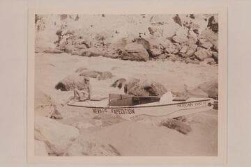 Nevills aiding in the portage-lining of the "Mexican Hat II" at Lava Falls