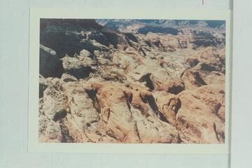 Southwest across the head of 73 toward the area of Rainbow Bridge and Cummings Mesa. The toe of 6069 is upper left