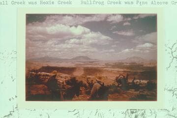 Art Ekker and Bates Wilson looking across Hall creek and Gullfrog Creek to the Henry Mountains