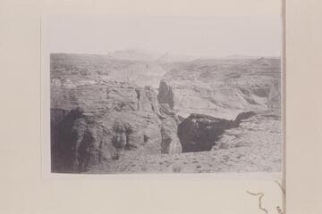 Up Glen CAnyon showing Cummings Mes and Navajo Mountain from left bank of Glen Canyon and probably near the Crossing of the Fathers