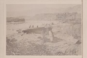 Small boat on beach above the placer operations at Lees Ferry
