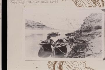 The "Canopy" after losing her canopy at Mile 105 1/2. The skiff "W. H. Bradley" is at right. Near Hole in the Rock. Between Aug. 25 and 28, 1910