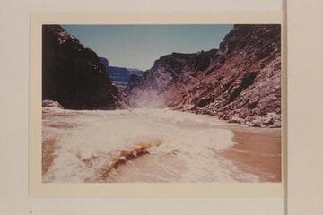 The wake of the "KIWI" as she tops out of 232 Mile Rapid at Mile 232.4. The "WEE YELLOW", the "WEE RED" and the "DOCK" are in and below the rapid