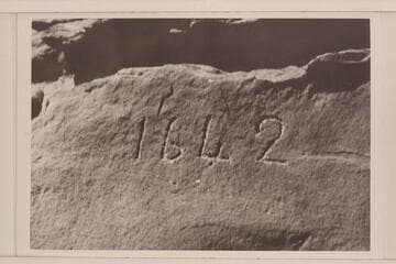 Inscription cut in rock at right bank in Glen Canyon opposite Lake Creek at Mile 113.  It is generally thought to be a fake