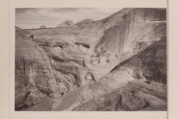 Up the canyon of the drainage which enters the river at Mile 71.5. Moepitz Airfield is upper left