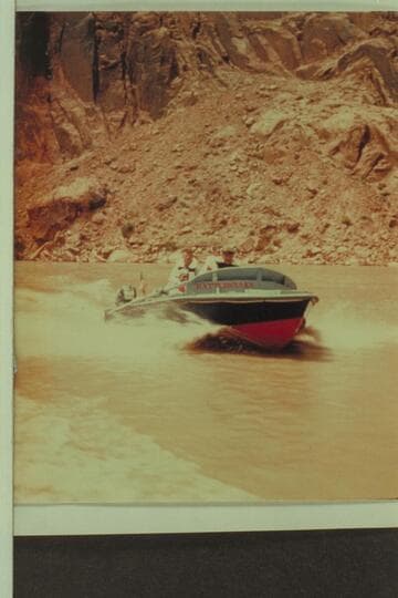 The shakedown cruise up into Glen Canyon. Butchart sits on the deck aft. Lodell Mathews is down in the cockpit. Preston Mercer is almost hidden by Rod Sanderson who is at the controls