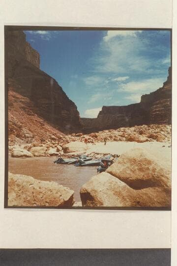 Boats at beach below 24.5 Mile Rapid. Willie walks down the beach