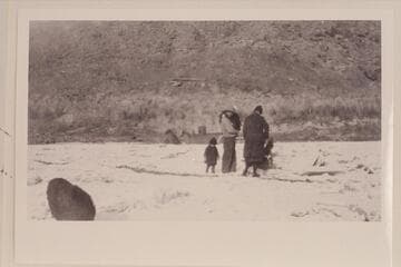 Sid Wilson on the ice at Lees Ferry.  Sid's daughter stands behind him.  Note the boiler of the steamer "Charles H. Spencer."  Photo is middle of print copied by negative 25-1 LSFY 39
