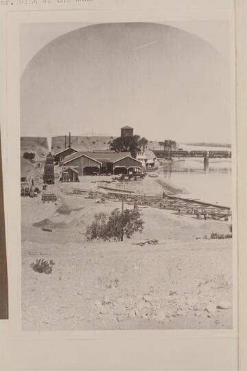 Shops of the Colorado Steam Navigation Company, Yuma. The bridge was built about 1878. Steamer "Gila" at the bank