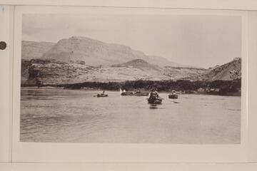 The Grand Canyon Survey party leaving Lees Ferry.  Canvas boat "Mojave" at the left