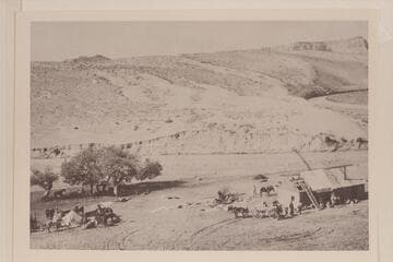 Camp and shed of the Charles H. Spencer mining operation on the San Juan River