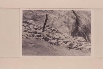 Looking up to face of ruin and stick. Inside of downriver wall forming stub canyon at foot of Valentine Bottom at Mile 24.6