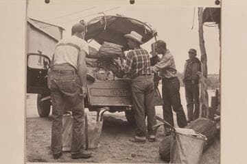 Loading the Power Wagon to run out to the edge of Rainbow Plateau to meet the stock- Ralph Cameron, Bill Belknap, Jorgen Visbak and Bahe; Navajo Mountain Trading Post