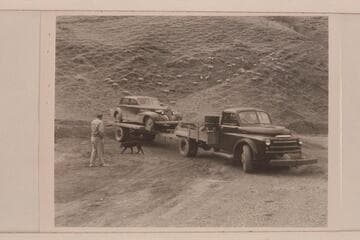 Truck and trailer which had hauled the car around to end of trip and to haul the sweep-scow on the return, Higgins to Salmon