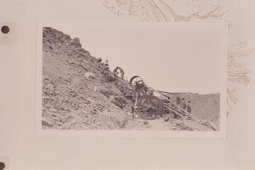 The Spencer operation on the San Juan. Crushing the Wingate. Plant at Camp Ibex. Men at top are feeding rock to the crusher. The single cylinder Otto gas engine is furnishing the power
