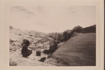 Tobe Owl watches repairs to Tom's horse. On trail west of Nasja Creek