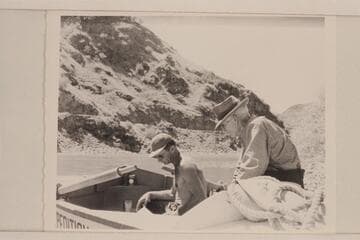 The old timer at Homestead watches Nevills study his chart; Snake River run of 1946
