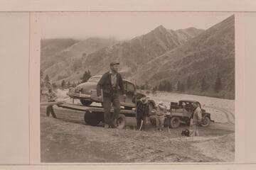 The heavy truck and trailer designed for hauling the scow back to Salmon City also freights the car of passengers around to the end of the trip.  Don Smith is foreground
