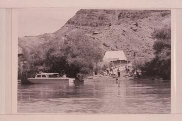 Motorboats at Lees Ferry. Higgins boat of Bureau of Reclamation at left. Art Greene's air prop boat at center