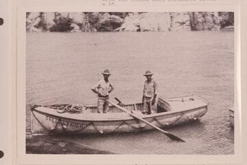 The "Dellenbaugh." One of Clyde Eddy's boats used in the traverse of the Cataract and Grand Canyons in 1927. Galloway and Eddy stand in the boat