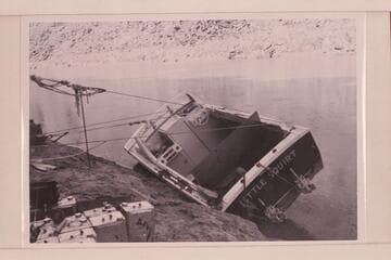 The twin jet "Little Squirt" rolled at Mile 4 for repairs.  After temporary repairs the trip was abandoned and a new start made June 18.  This boat became known as the "Big Red."  It completed the run through the Grand Canyon in June