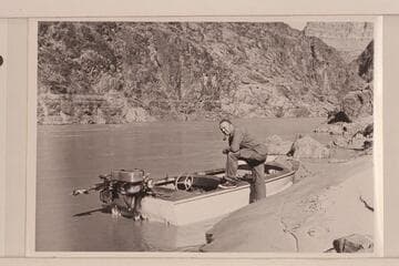 Bill Belknap at Jordan's outboard boat near Mile 234. Belknap and Jordan ran up to this point and waited for the 1952 power cruise of the Wright-Rigg party in May