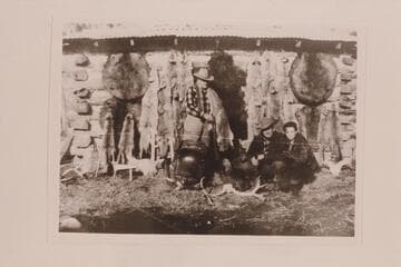Frank A. Brewer and meat in the pot. The one-in-a-thousand gold-mounted Winchester. Some fur. George Scott and neice