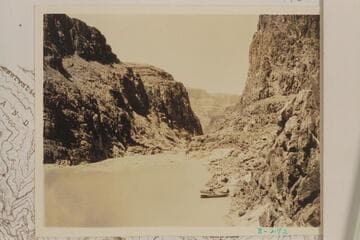 Downstream at the head of Separation Rapid- right bank. The three boats of the Dusty Dozen appear at lower right