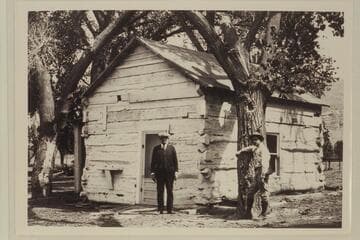 Robert Burns Hildrebrand and Charles Kelly at the original Lee cabin, Lees Ferry