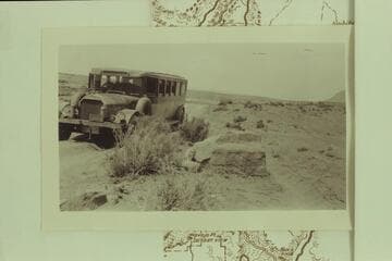 Bus en route to Marble Canyon bridge dedication. Between Cameron and the bridge. Print from the Freeman collection