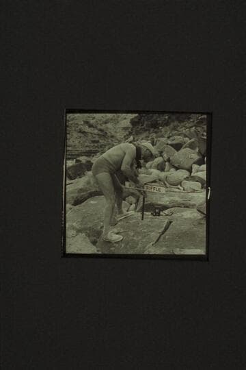 Marston pounding home the sign at Browns Riffle; Mile 12 in Marble Canyon where Frank Mason Brown was drowned 1889, July 10