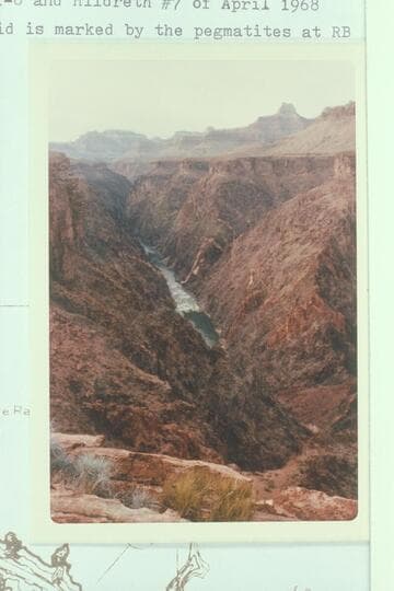 Downriver from Spur Trail which reaches the river at Mile 80.8.  Grapevine Rapid is marked by the pegmatites at right bank