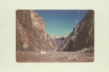 Bob Rigg piloting Chris-Craft kit boat at foot of Grapevine Rapid. Bright Angel gauge: 67,300 cfs., the peak for the year