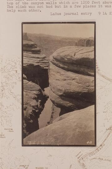 Down from the rim to the Colorado River in Cataract Canyon at approximately Mile 215. One mile below mouth of Green River