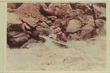 Buzz Belknap piloting the "Bootoo" through Vulcan Rapid. Dock Marston is the passenger