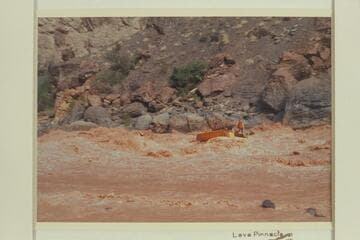 Rowlanfd Deck Boat swings to the left and clear at Vulcan Rapid. Jim-Bob Rowland was at the wheel and killed one engine. Wes Hildreth was aboard and is seen waving to his wife on shore