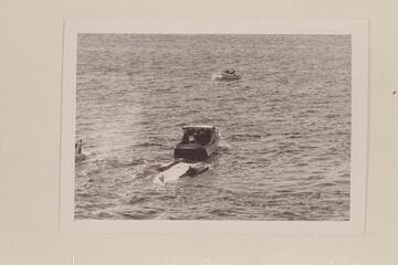 The "Gale V" being towed off the course after flipping on Lake Mead in the Gold Cup Races