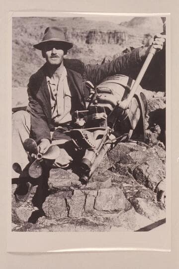 Aleson with wrecked motor.  Four cylinder Evinrude Sportfour.  Granite Springs Rapid.  Aleson attempted a run up the river and it ended at Granite Springs Rapid when the motor was wrecked