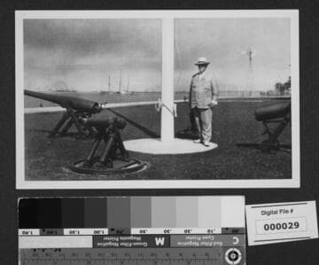Harrison Gray Otis standing by war memorial near Los Angeles Harbor