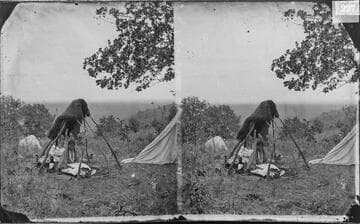 Minnehaha (Cheyenne) in open summer lodge, making bead work