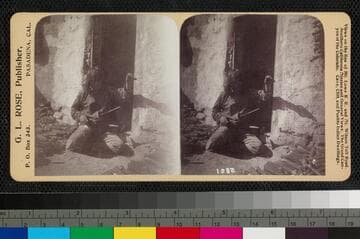 A Hopi man holding a spool, spinning yarn