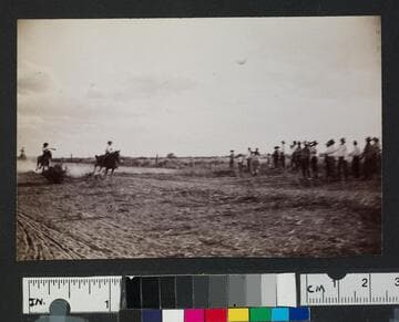 Men riding horses in a race