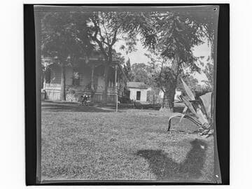 Unidentified house with a child on a swing